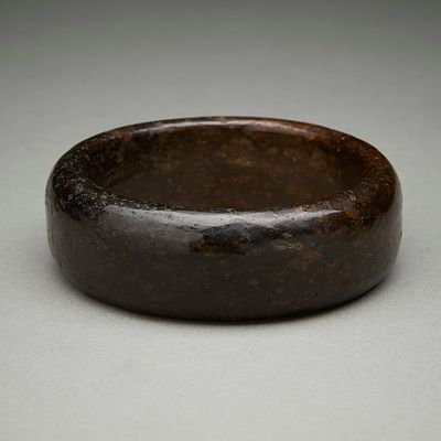 Chinese Carved Brown Jade Bangle Bracelet. Chinese carved brown jade bangle or bracelet. With a 