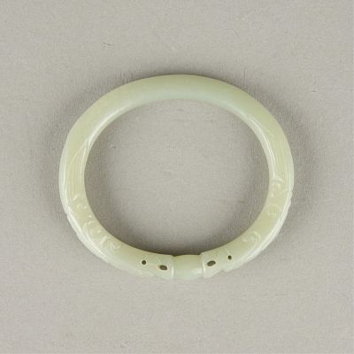 Chinese Pierced & Carved Jade Bangle. Chinese pierced and carved jade bangle. Of a lovely pale 