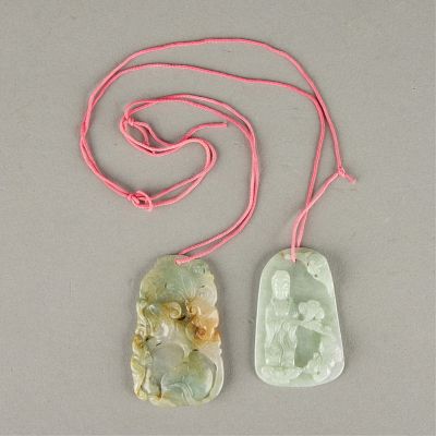2 Carved Jade Pendants. One carved with a figure of a guanyin and a small creature. The other 