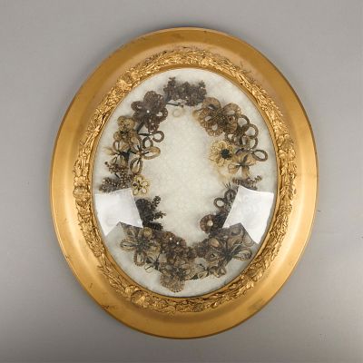 Victorian Hair Wreath. Ornate Victorian hairwork wreath. In the shape of flowers. In a bubble 