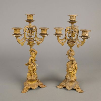 Pair Bronze Figurine Candelabra. Pair of French style bronze candelabras. Each with three arms 