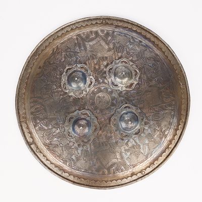 Reproduction Persian Shield. Reproduction Persian metal shield. Incised design of figures 