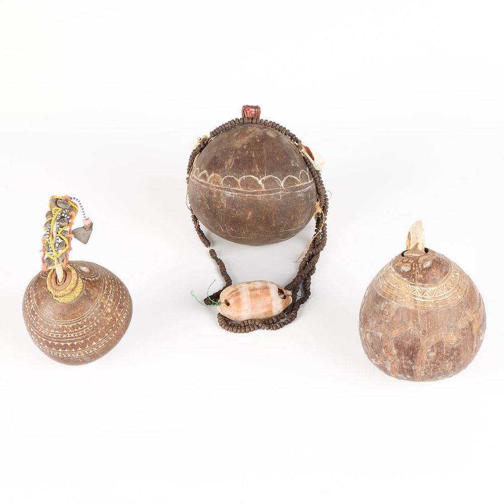 Lot 341: 3 PNG Massim Carved Coconut Vessels