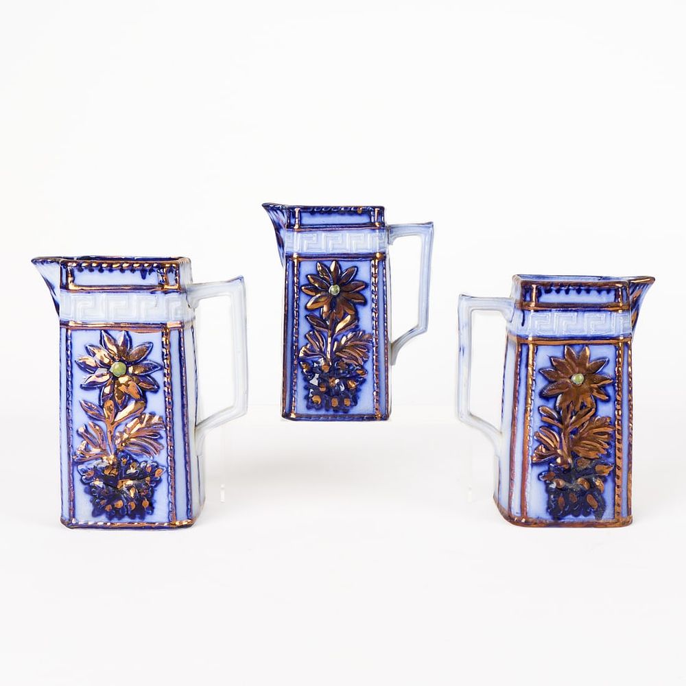 Lot 583: 3 Staffordshire Style Flow Blue Ceramic Pitchers