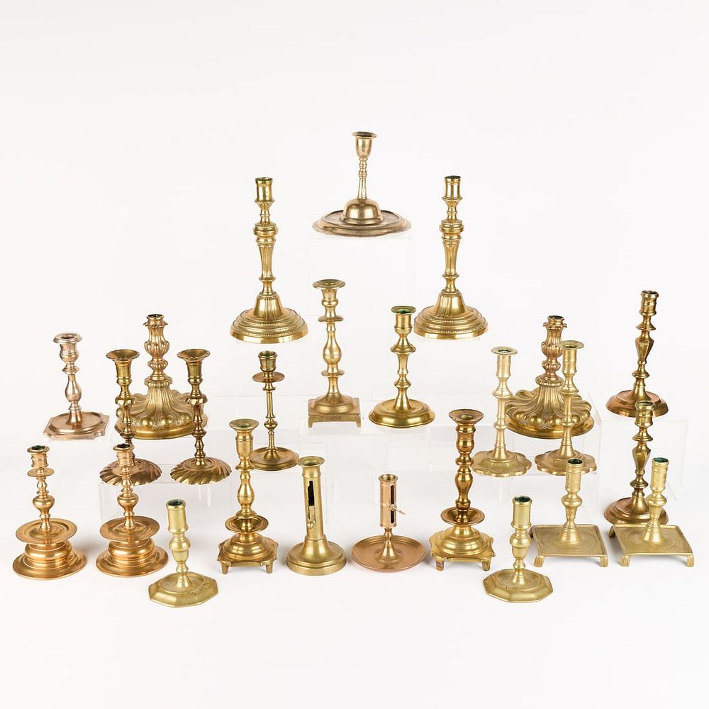 Lot 708: 25 Brass Candlesticks