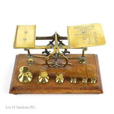 Antique Brass and Wood Postal Scale w/ Weights. Antique brass postal scale on a wooden base 