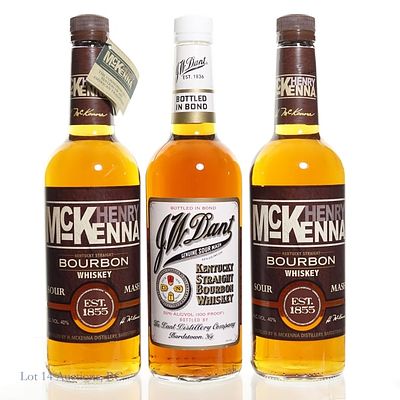 J.W. Dant Bottled in Bond & 2 McKenna Bourbons (3). Three (3) bottles of bourbon - J.W. Dant 