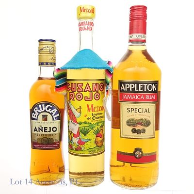 Gusano Mezcal, Appleton Rum, and Brugal Rum Lot. Three bottles total in this lot. The first is a 