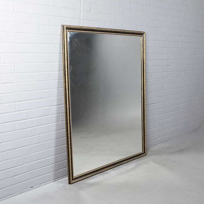 WALL MIRROR antique style of substantial proportions with a bevelled plate and black and gilt 