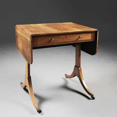REGENCY ROSEWOOD PEMBROKE TABLE circa 1815, boxwood strung with drop flap top above a drawer 