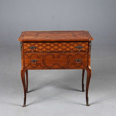 TRANSITIONAL STYLE PETITE COMMODE tulipwood, marquetry and gilt metal mounted of two drawers 