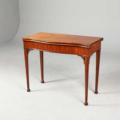 GEORGE III WALNUT SERPENTINE CARD TABLE green baize playing surface, 72cm H x 90cm W x 44cm D.