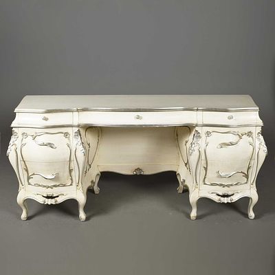 ROCOCO STYLE PAINTED AND SILVERED DRESSING TABLE bombe form with seven drawers, 81cm H x 180cm 