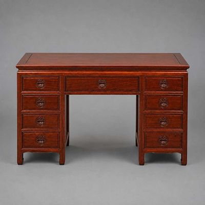 CHINESE PADOUK KNEEHOLE DESK Nine drawers, 79cm H x 127cm W x 61cm D. one piece