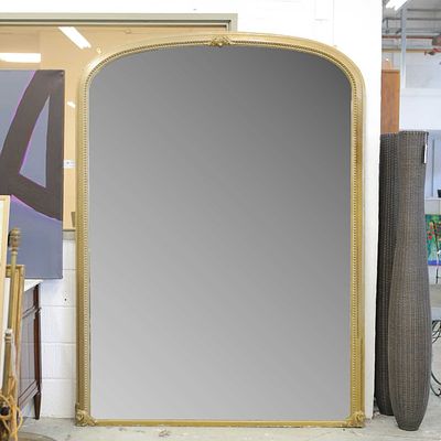 VICTORIAN OVERMANTEL MIRROR of large proportions with a gold painted arched frame 227cm H x 180cm W.