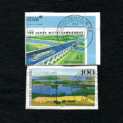 Two German Postage Stamps: Mittelland Canal (2005) and Mecklenburgische Seenplatte (1994). A 
