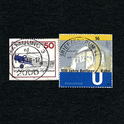 Two German Commemorative Stamps Used: 100 Years Berlin Metro (2002) and 50 Years Lufthansa (1976). 