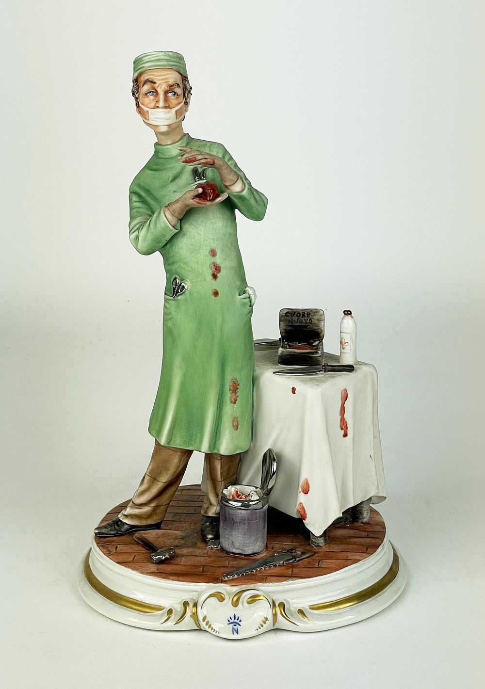Polychrome artistic porcelain marked Capodimonte, representing surgeon, rich in detail and 