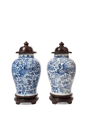 A PAIR OF BLUE AND WHITE PORCELAIN VASES. h cm 32,7Decorated with phoenixes flying over a floral 