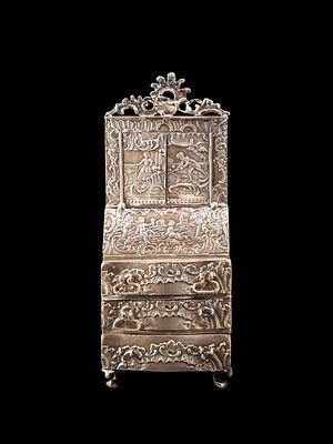 SMALL SILVER TRUMEAU, Austria, 19th century. h cm 14.Finely engraved and embossed with scenes of 