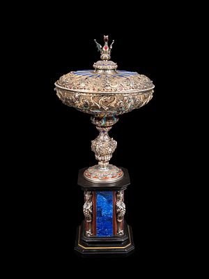 IMPORTANT SILVER AND ENAMEL CUP, Vienna, c. 1860. h tot. cm 50 (cup alone: h cm 32).In the 