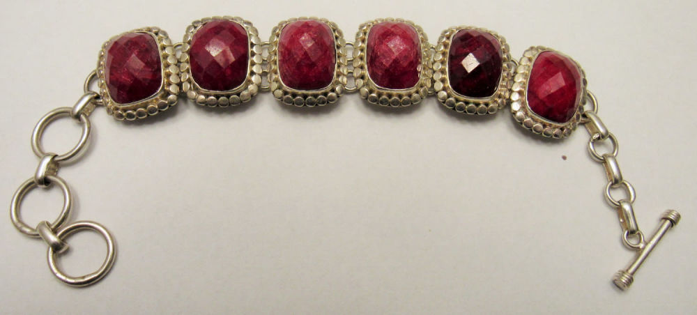 Lot 191: STERLING SILVER BRACELET WITH MULTI-FACETTED GEMSTONES.OVERALL LENGTH 8.25"