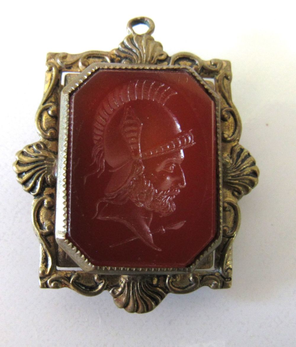 Lot 53: LATE VICTORIAN CARNELIAN INTAGLIO WARRIOR LOCKET/WATCH FOB.