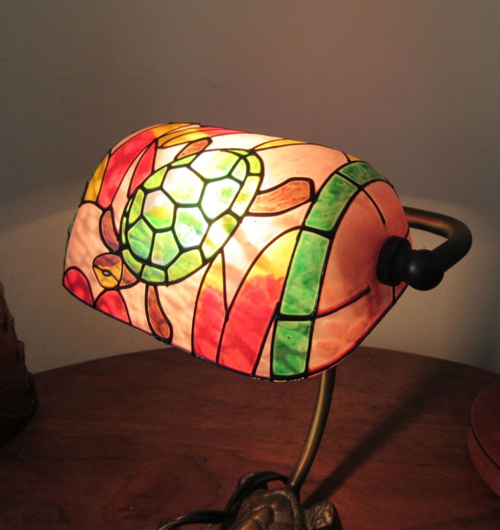 Lot 161: CONTEMPORARY TURTLE LAMP WITH GLASS TIFFANY STYLE SHADE.10" OVERALL HEIGHT.