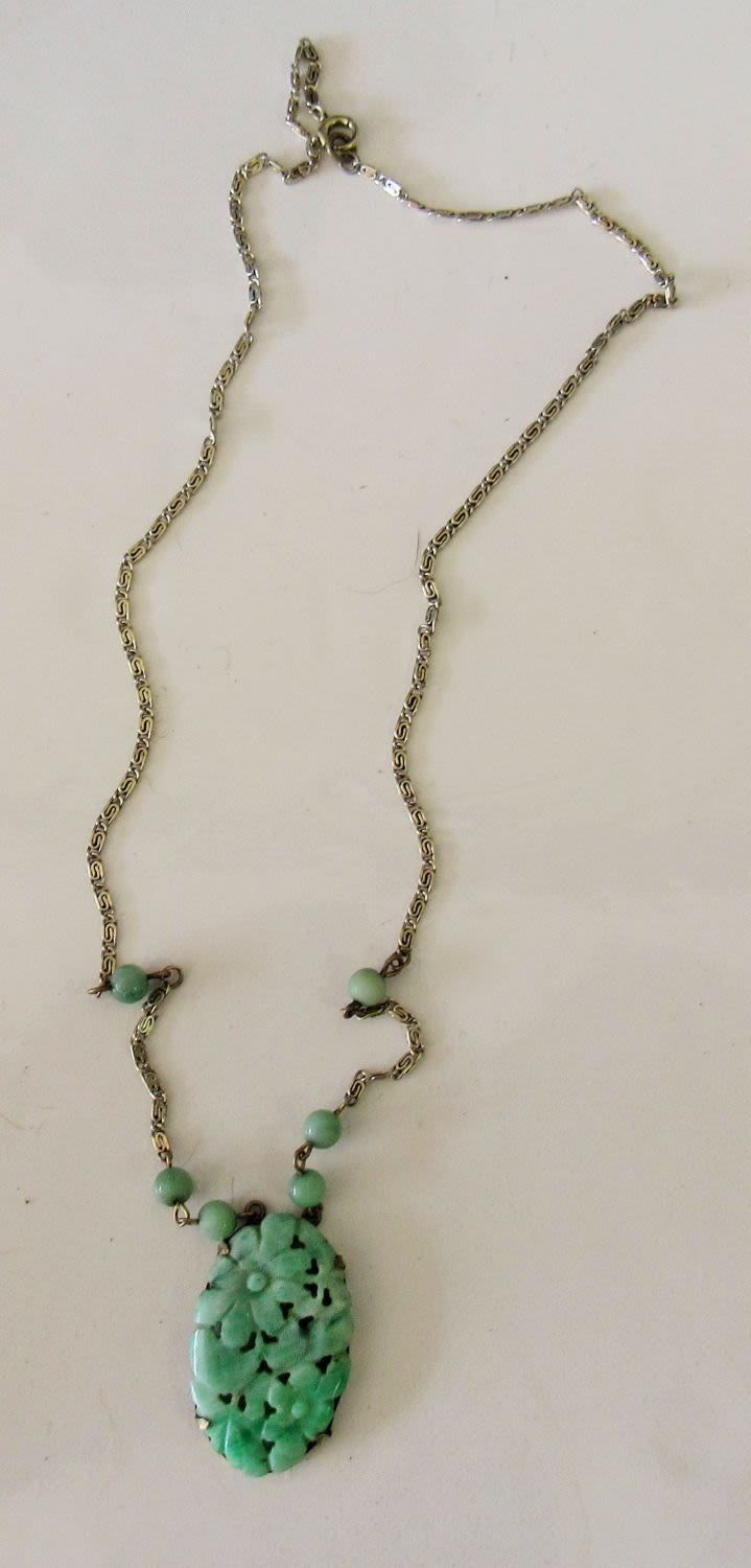 Lot 68: ANTIQUE CARVED JADE PENDANT ON SILVERTONE GREEK KEY NECKLACE (POSS. LOWER GRADE SILVER).