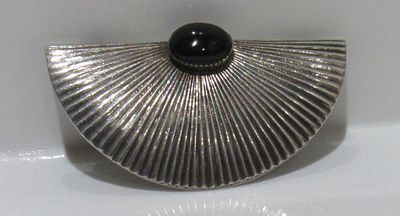 MCM STERLING SILVER WITH ONYX CABOCHON INSET BROOCH.