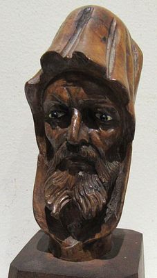 CARVED MOUNTED FIGURAL. VERY WELL EXECUTED. POSSIBLY A CANE HEAD.