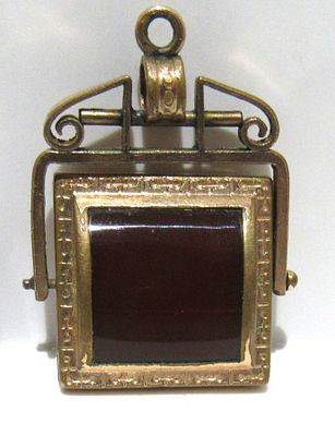DOUBLE SIDED SWIVEL G.F. EDWARDIAN WATCH FOB, ONE SIDE IS CARNELIAN OTHER IS ONYX.