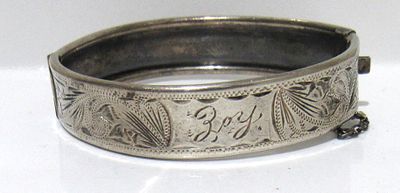ANTIQUE STERLING SILVER CHILD'S BRACELET. ENGRAVED "JOY".