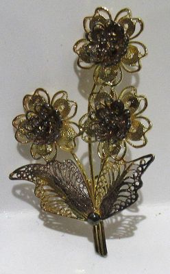 STERLING SILVER FILIGREE WITH GOLD WASH FLORAL BROOCH.
