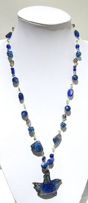 ELEGANT HAND ASSEMBLED NECKLACE WITH MILLIFIORI STYLE GLASS BEADS.