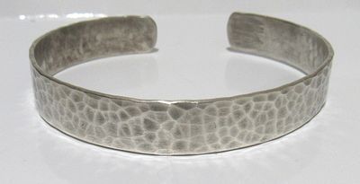 HAND HAMMERED SIGNED MCM STERLING SILVER CUFF BRACELET.