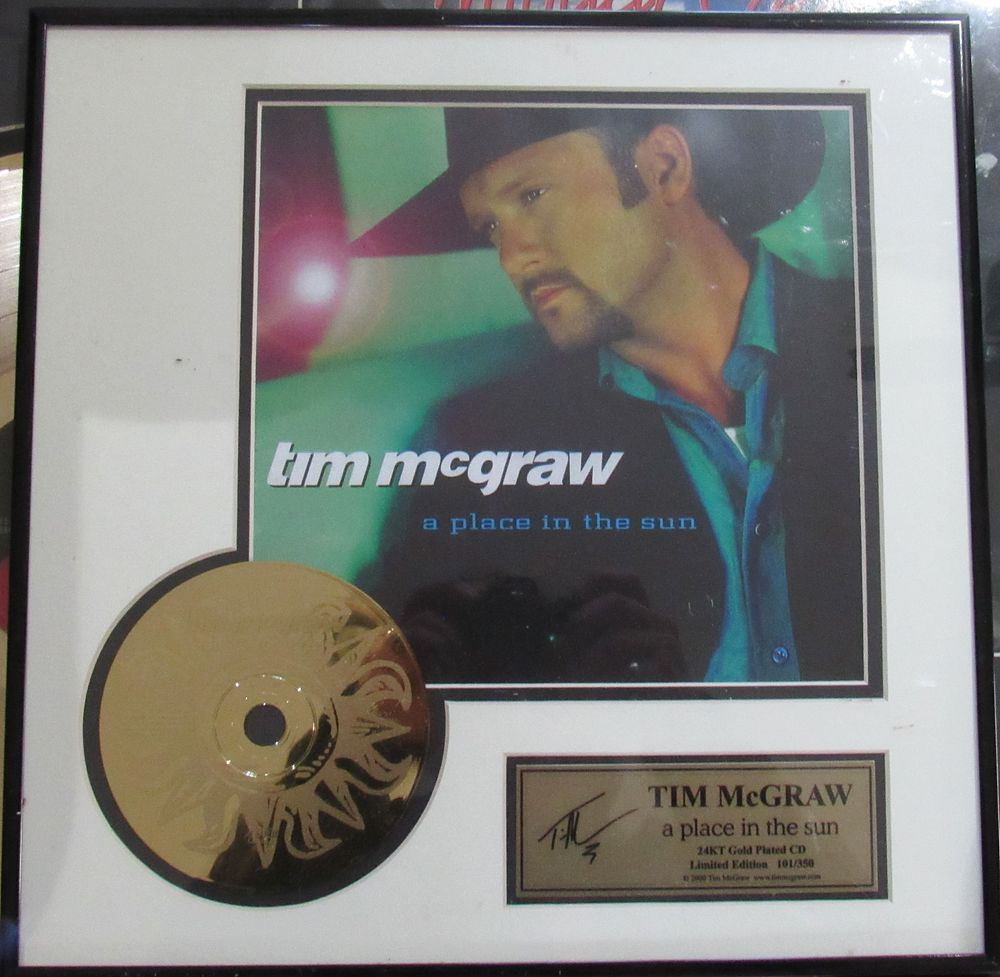 Lot 84: TIM MCGRAW FRAMED "A PLACE IN THE SUN" GOLD CD. EXCELLENT CONDITION.