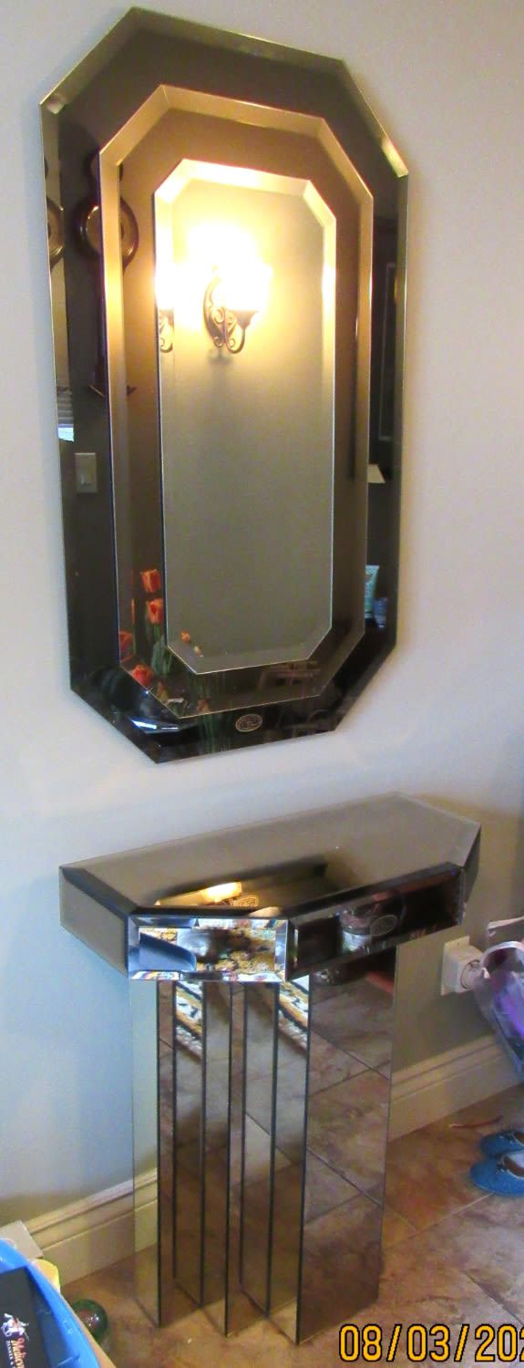 Lot 91: ART DECO STYLE MIRRORED GLASS TABLE AND MATCHING MIRROR.CUSTOM MADE IN CANADA. PICK UP ONLY.