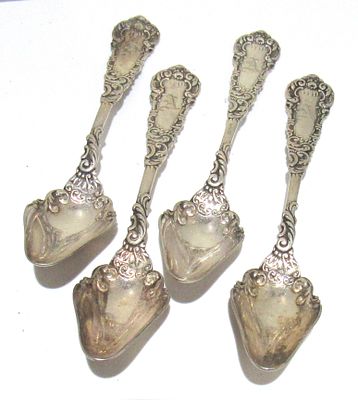 BIN PRICE $10. 4 ORNATE SILVERPLATE MELON/GRAPEFRUIT SPOONS. W.H. GLENNY.