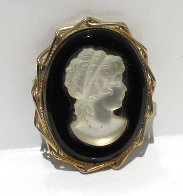 FROSTED GLASS CAMEO BROOCH WITH ONYX BACKING.