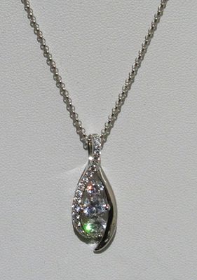 STERLING SILVER NECKLACE AND PENDANT WITH DAZZLING ICE CRYSTALS.