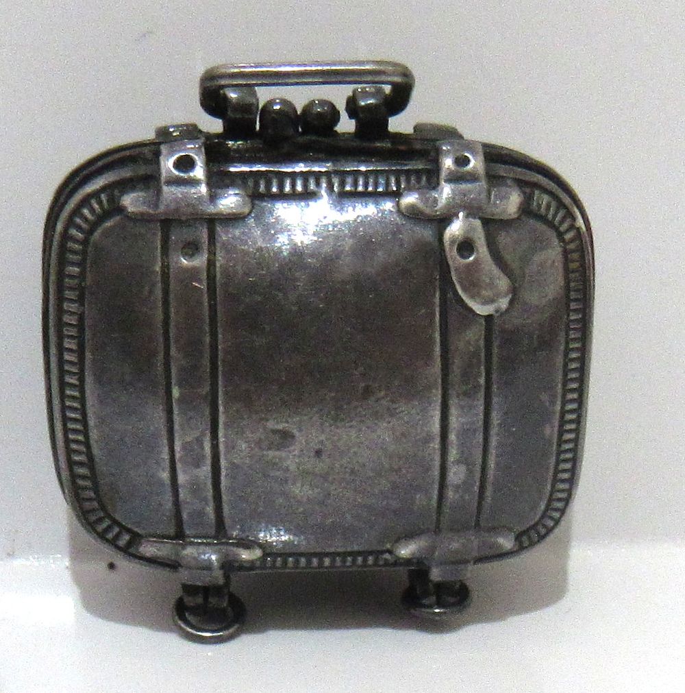 BIN PRICE $45.VINTAGE SUITCASE FORM STERLING SILVER PILL CONTAINER. MARKED 925 ON INSIDE.