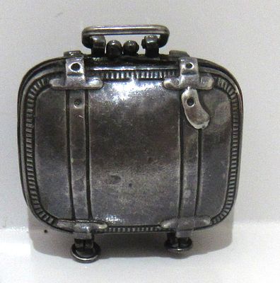 BIN PRICE $45.VINTAGE SUITCASE FORM STERLING SILVER PILL CONTAINER. MARKED 925 ON INSIDE.