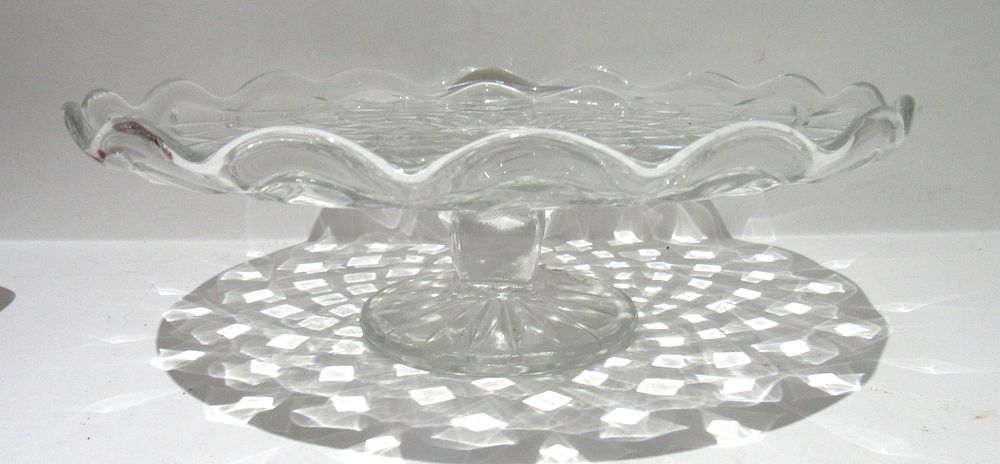 Lot 247: BIN PRICE $20. FANCY PRESSED GLASS FOOTED SWEETS TRAY.