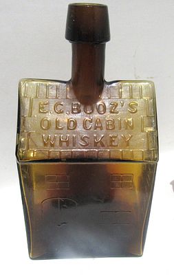 ANTIQUE E.C. BOOZ'S LOG CABIN WHISKEY BOTTLE.