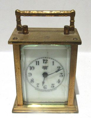 WATERBURY MINIATURE CARRIAGE CLOCK "AS FOUND" FOR REPAIR OR PARTS. PLEASE VIEW ALL PHOTOS.