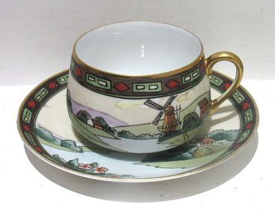 HAND PAINTED NIPPON ART DECO/ARTS AND CRAFTS CUP AND SAUCER.