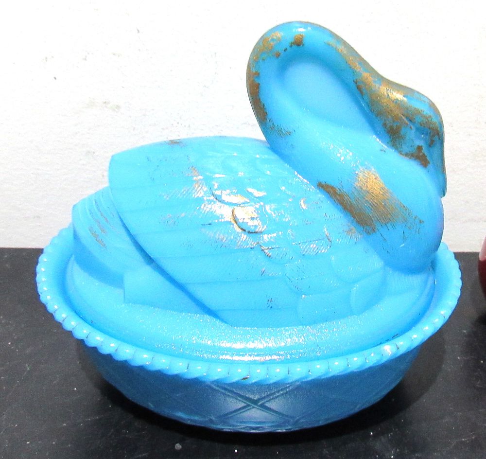 Lot 394: BUY-IT-NOW PRICE $25. VINTAGE BLUE SWAN ON NEST. GOLD OVERPAINT.