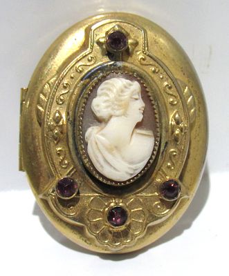 BUY-IT-NOW PRICE $25. LATE VICTORIAN GOLD TONE CAMEO LOCKET WITH AMETHYST CRYSTALS.