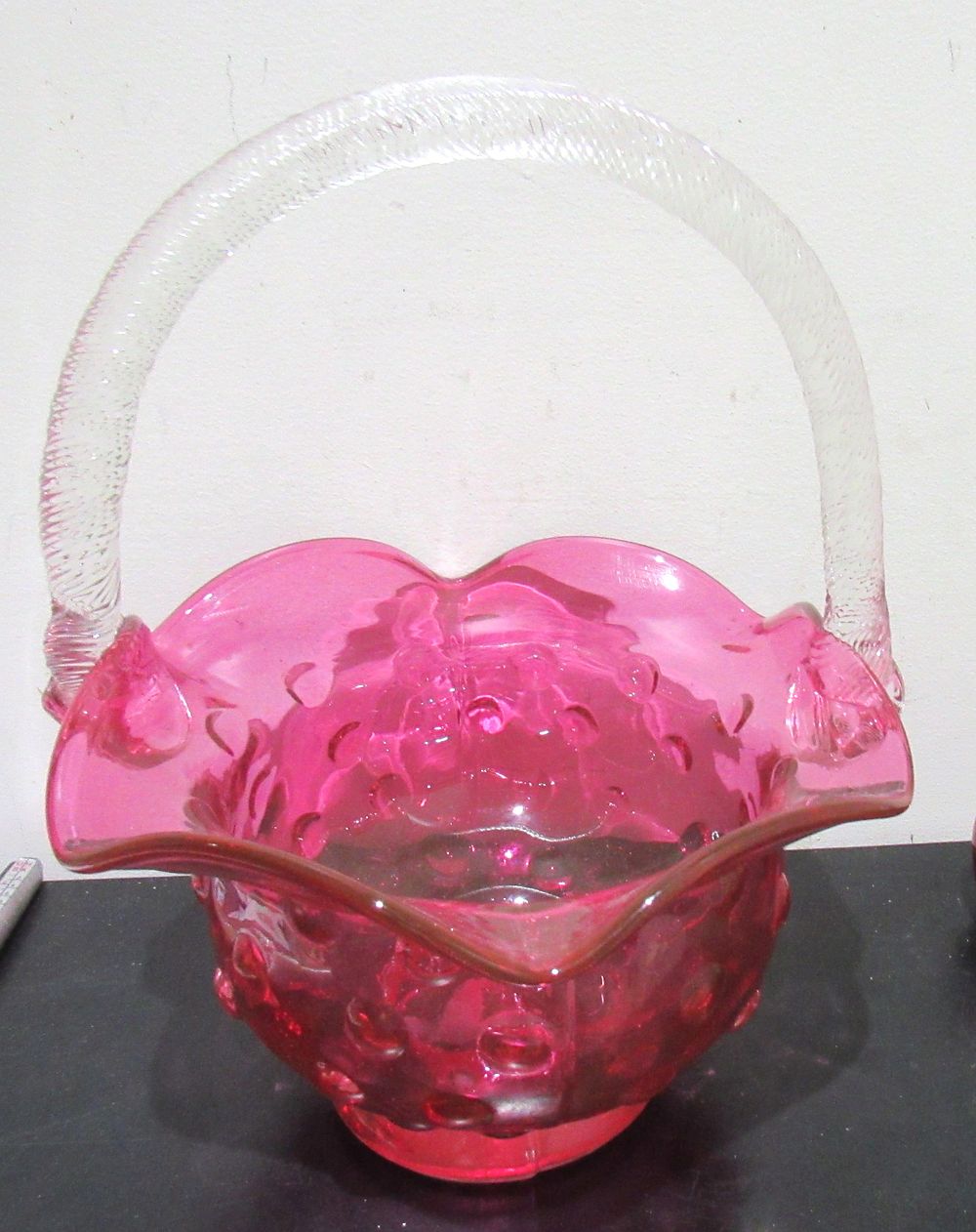 Lot 565: BUY-IT-NOW PRICE $45. LARGE CRANBERRY COIN DOT BASKET WITH APPLIED CLEAR HANDLE.